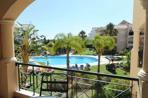 View of the Pool and lawns from balcony.