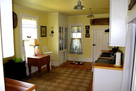 Kitchen with electric range/stove, dishwasher, microwave and refrigerator.