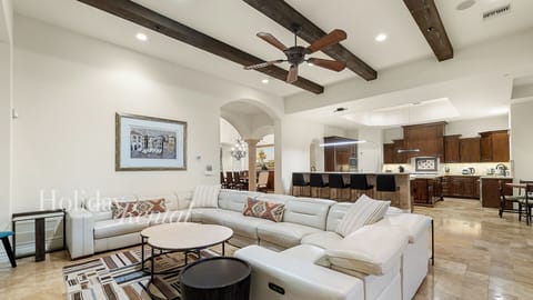 Soaring beamed ceilings, open kitchen & a patio that pulls you outside.