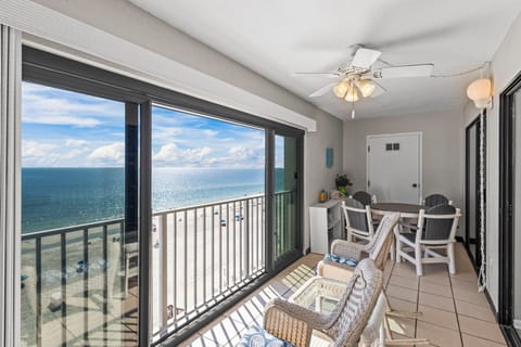 Gulf Tower 7C - Sip and relax on the glass-enclosed balcony with a cup of coffee and Gulf views.