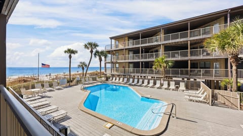 Sandpiper 7A - Enjoy beautiful views of the pool and Gulf right from the deck.