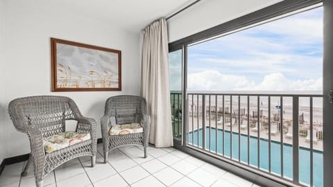 Gulf Tower 1C - West-facing pool and Gulf views from the glass-enclosed balcony.