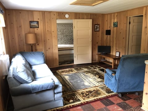 Repurposed furniture and new rug to replace the one that was glued to the floor.