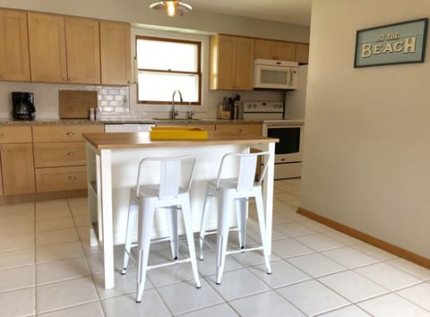 Fully stocked modern kitchen with room to cook and gather.