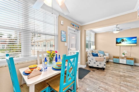 Beautiful dining area by the window, located between the living and kitchen spaces.