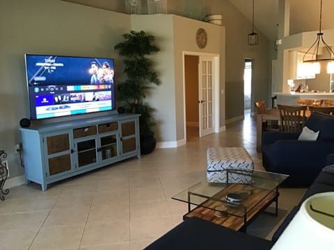 Living Room. Includes new 75 inch TV and new couch & chair.
