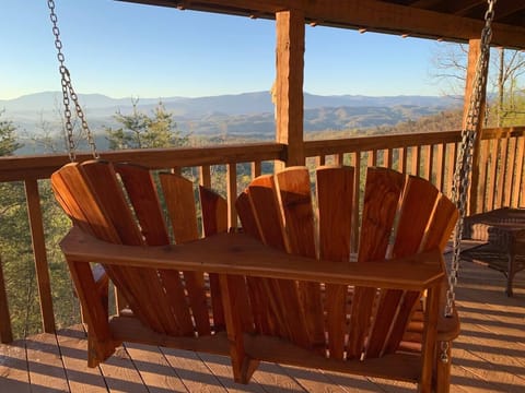 A warm, wood-accented exterior invites you into a peaceful getaway surrounded by nature.