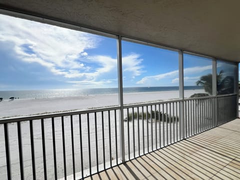 2025 Photo: Ahhhh... A place for everyone.  Enjoy the outdoor spaces overlooking the tranquil Gulf of Mexico and white sandy shoreline. Screened balconey offers seating for all.  Have Breakfast or Happy Hour and SMILE