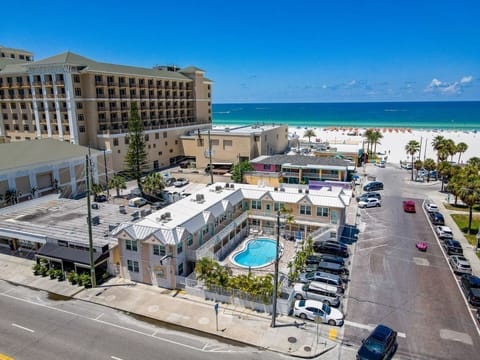 Whether you're lounging by the heated courtyard pool or walking to dinner on Mandalay Avenue, it is the ideal base for couples or small families seeking a peaceful beach escape.
