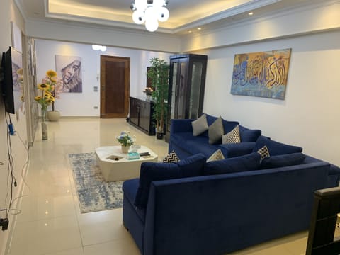 Elite Apartment | Living area | 32-inch Smart TV with satellite channels