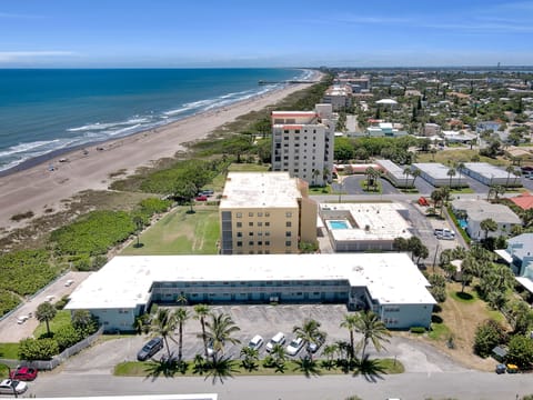 Our beach and building looking south, a  nice beach walk to Cocoa Beach Pier!