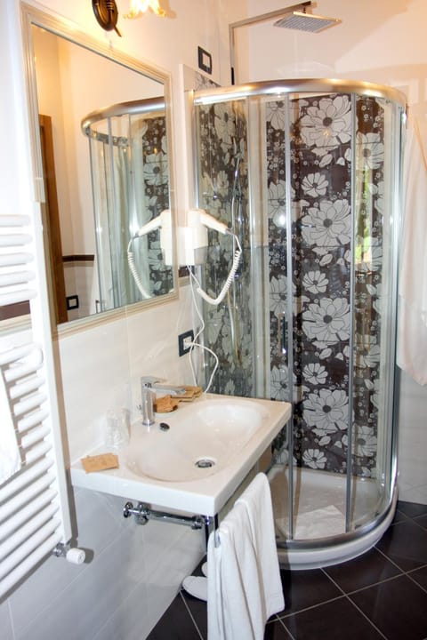 Shower, free toiletries, hair dryer, slippers