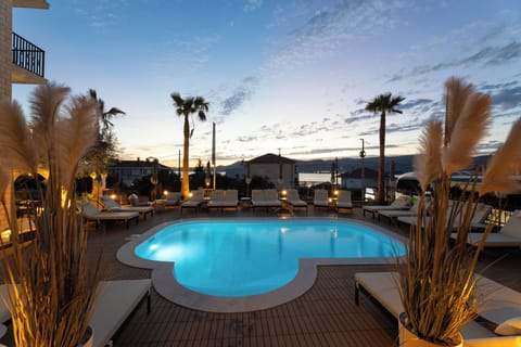 Seasonal outdoor pool, open 10:00 AM to 7:30 PM, pool umbrellas
