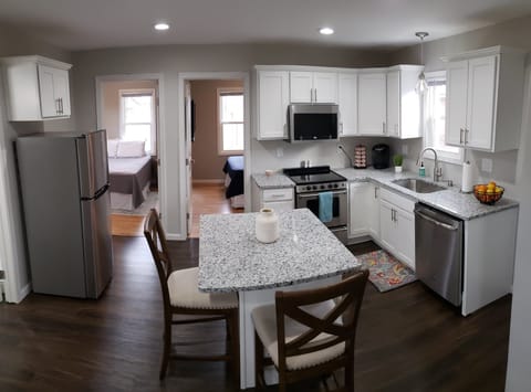 Two private bedrooms tucked behind the kitchen allow for privacy and function in our cozy little home!