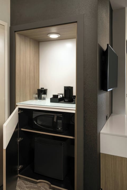 Desk, laptop workspace, iron/ironing board, cribs/infant beds