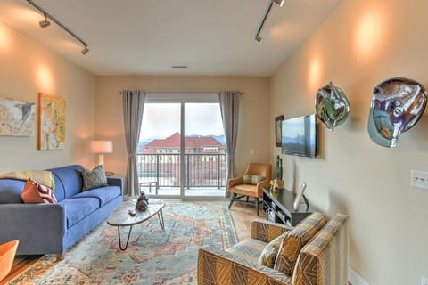 The living space from another angle — clean lines, natural light, and plenty of room for four guests to relax.