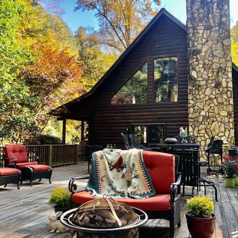 This wonderful Cabin features huge rock fireplace chimney and spacious Deck.