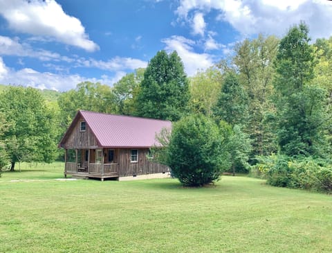 The Cozy Cabin with Full Upstairs Extending
Over the Front Porch