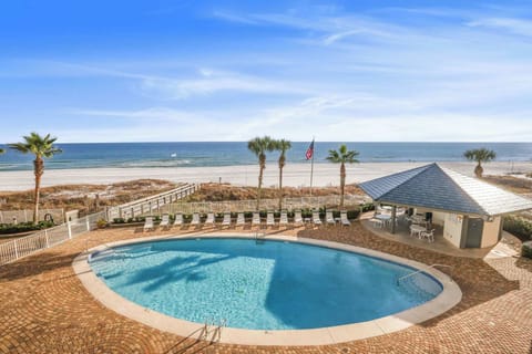 Beachside pool with expansive sundeck, gazebo, restrooms, & BBQ area.