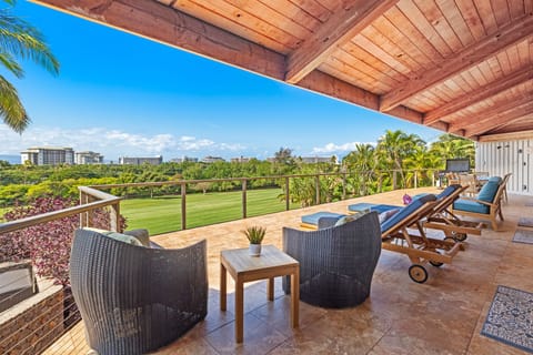 Relax on the covered lanai with ample lounge seating and scenic views, a perfect spot to unwind and enjoy the Hawaiian breeze.