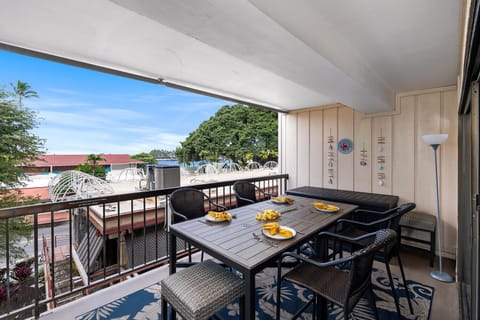 Your private lanai dining awaits with fresh fruit and city views, perfect for morning coffee or sunset meals.