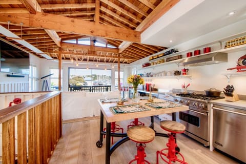 Kitchen area with Viking gas stove, Wolf induction cooktop, Viking dishwasher.