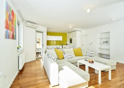 Apartment, 1 Bedroom, Sea View | Living room | Flat-screen TV