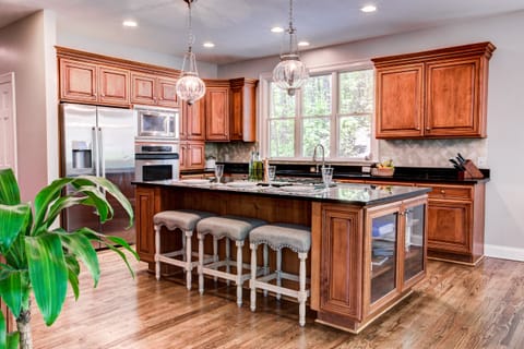 Large island (over 4' x 8') with pro 5-burner gas stove. Great place to gather.