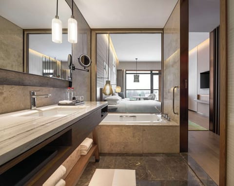 Separate tub and shower, rainfall showerhead, free toiletries