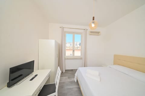 Economy Double Room | Desk, blackout drapes, cribs/infant beds, free WiFi