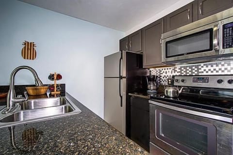 Condo, 1 King Bed (Banyan Tree 404D) | Private kitchen | Fridge, microwave, oven, stovetop
