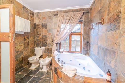 Honeymoon Room, Jetted Tub | Bathroom | Separate tub and shower, free toiletries, hair dryer, bathrobes