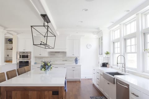 The kitchen island with four stools.