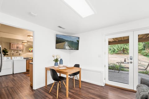 Wall-mounted TV with Netflix and Roku Apps. Relaxing recliners and landscape.