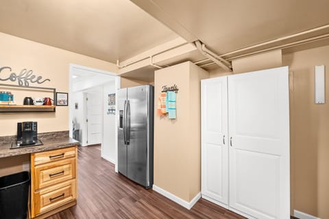 Full kitchen with a full-size fridge, stove, microwave, coffee, K-cup coffee