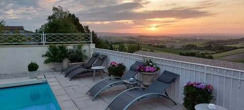 Outdoor pool, pool umbrellas, sun loungers