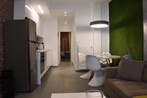 Deluxe Apartment (Gusto) | Living area | Flat-screen TV
