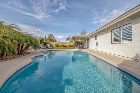Dive into your private oasis with crystal-clear waters reflecting the azure sky above your modern retreat.
