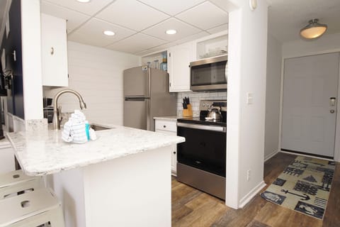 Your fully equipped kitchen awaits with granite counters, stainless appliances, and everything you need to create memorable meals during your stay.