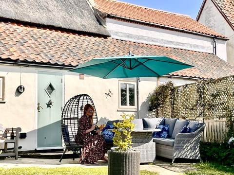 Relaxing on the patio on the rattan furniture and egg chair