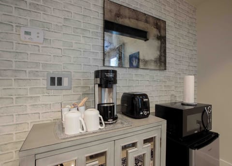 kitchenette includes: coffee maker, toaster, fridge, microwave