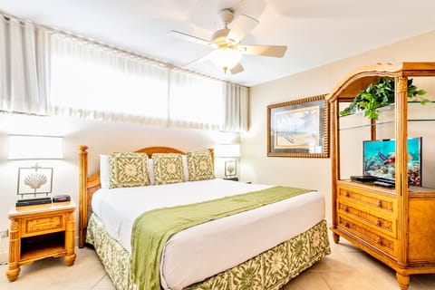 Sink into crisp linens and tropical charm in your private bedroom retreat. Coastal decor and thoughtful amenities create the perfect sanctuary for restful nights.
