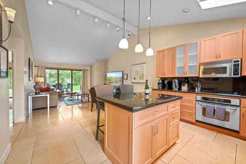 Open floor plan for kitchen and living room. New kitchen supplies, fully stocked! New 75 inch smart TV.  Golf views out rear patio