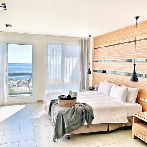 Grand Double Room, Ocean View | Blackout drapes, cribs/infant beds, rollaway beds, free WiFi
