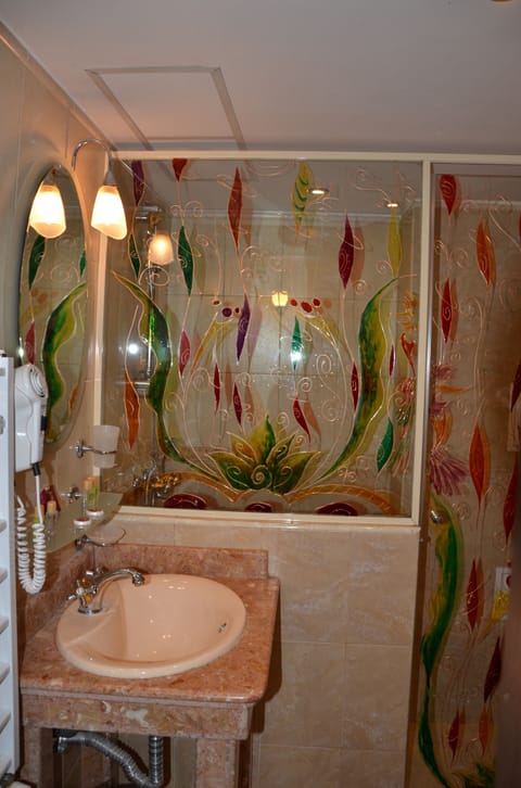 Economy Double Room | Bathroom | Shower, hair dryer, slippers, towels