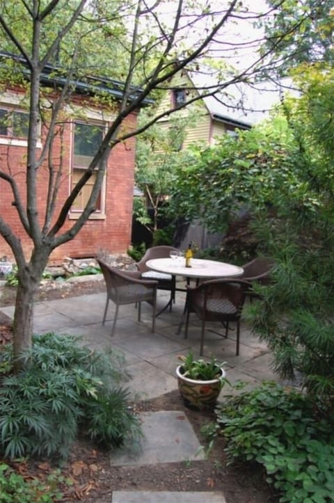 From a secluded terrace by the kitchen, stone paths lead to other gardens.