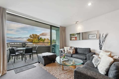 Open plan living with private balcony looking towards the Remarkables over looking Lake Wakatipu 