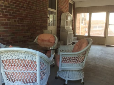 50's "breezeway" porch for socializing outside - with Wall mounted TV, table