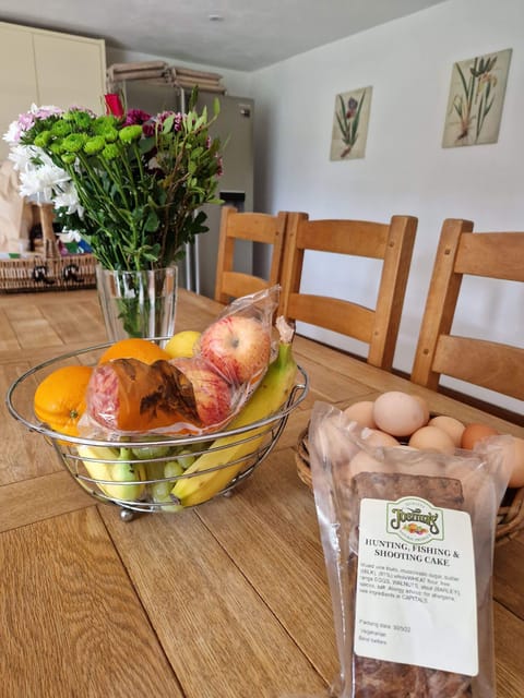 Beautiful welcome basket - fresh flowers, freshly laid eggs, home baked fruitcake, milk, cheese, wine, cereal, biscuits, etc.