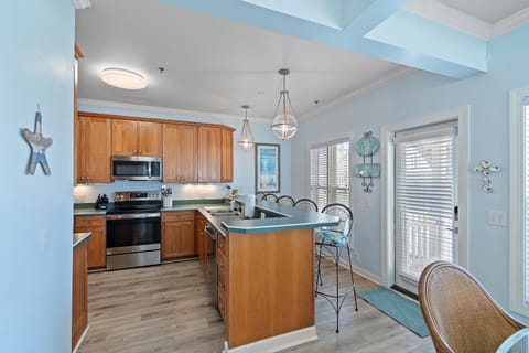 Full kitchen equipped with all you need for home-cooked meals by the Sea.